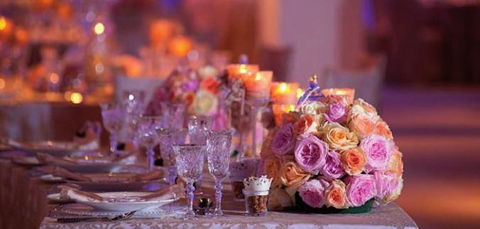 Table with rose centerpieces and candles