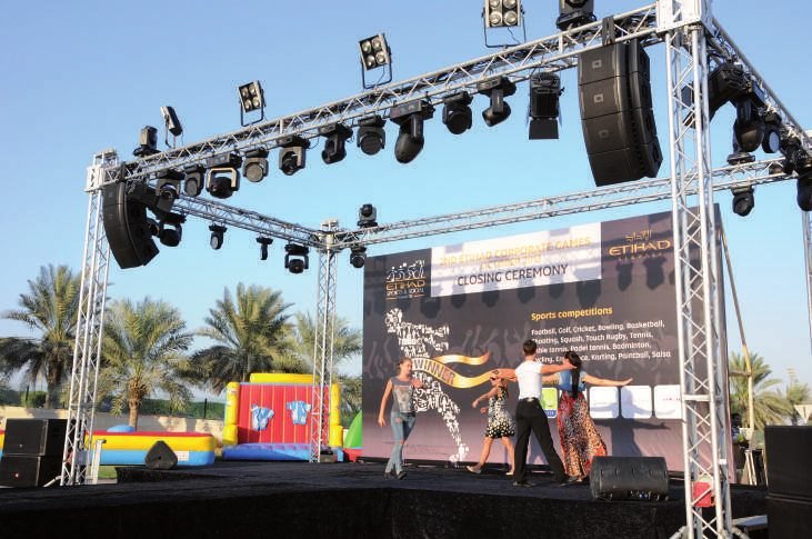 Outdoor stage with truss and speakers